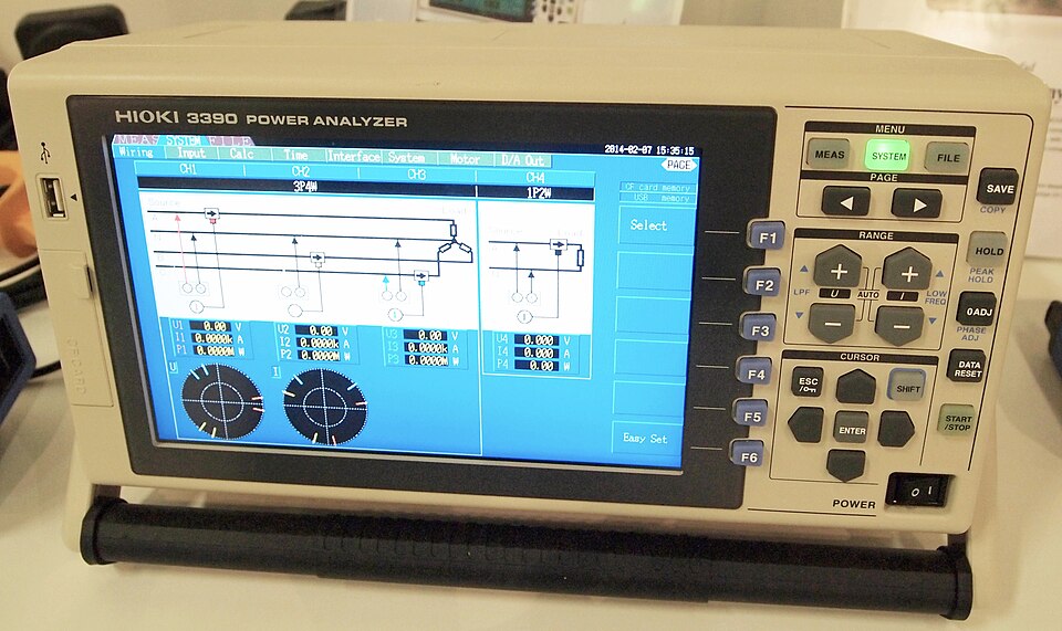 Hioki 3390 digital power analyzer displayed at an electrical trade fair in Jyväskylä, Finland.